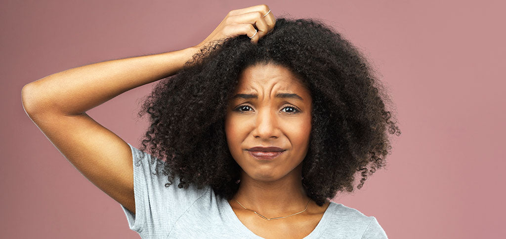 Image of attractive young woman looking unsure